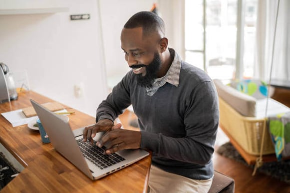 A man uses a laptop