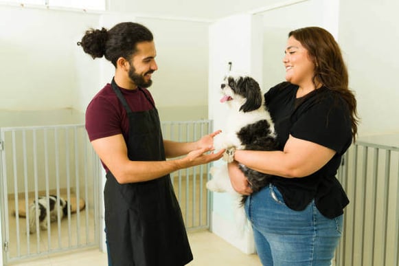 Dog owner bringing her dog to the dog daycare